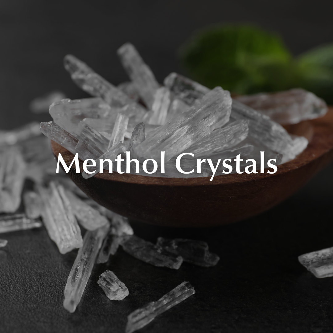 Menthol crystals in a wooden spoon with a dark background