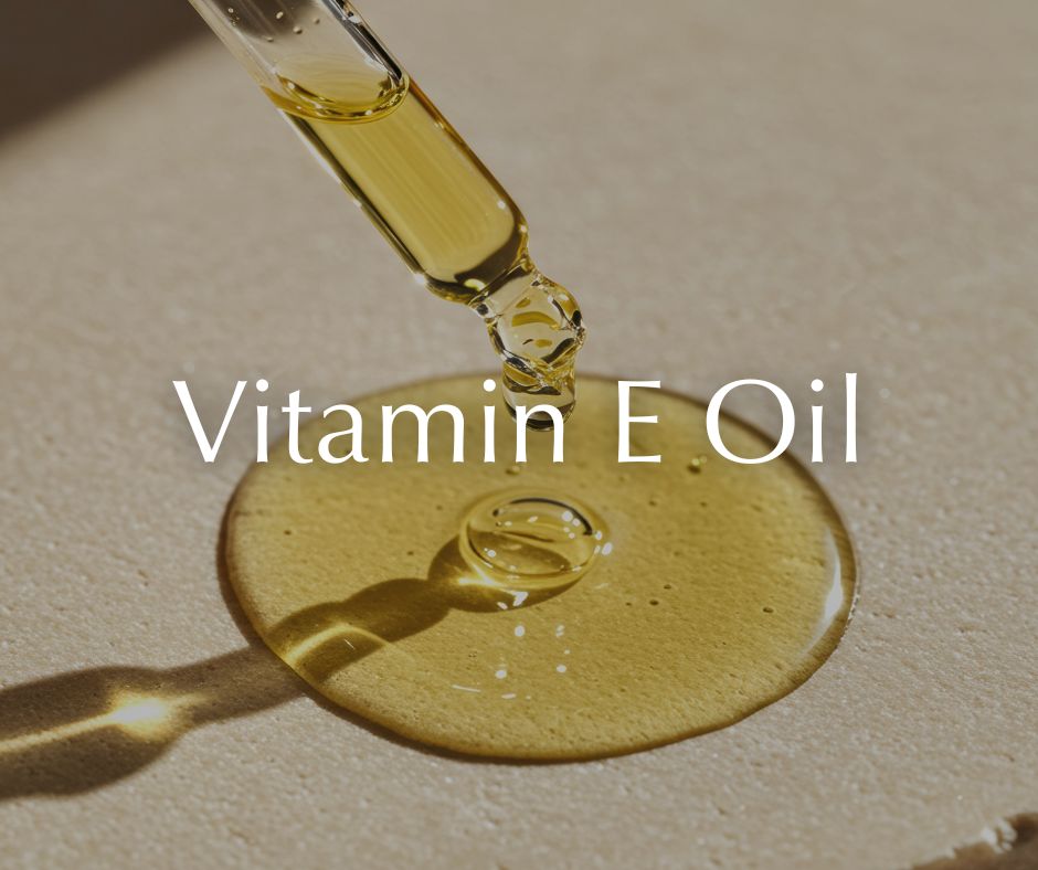 Vitamin E oil being dripped onto a surface with the text 'Vitamin E Oil'.