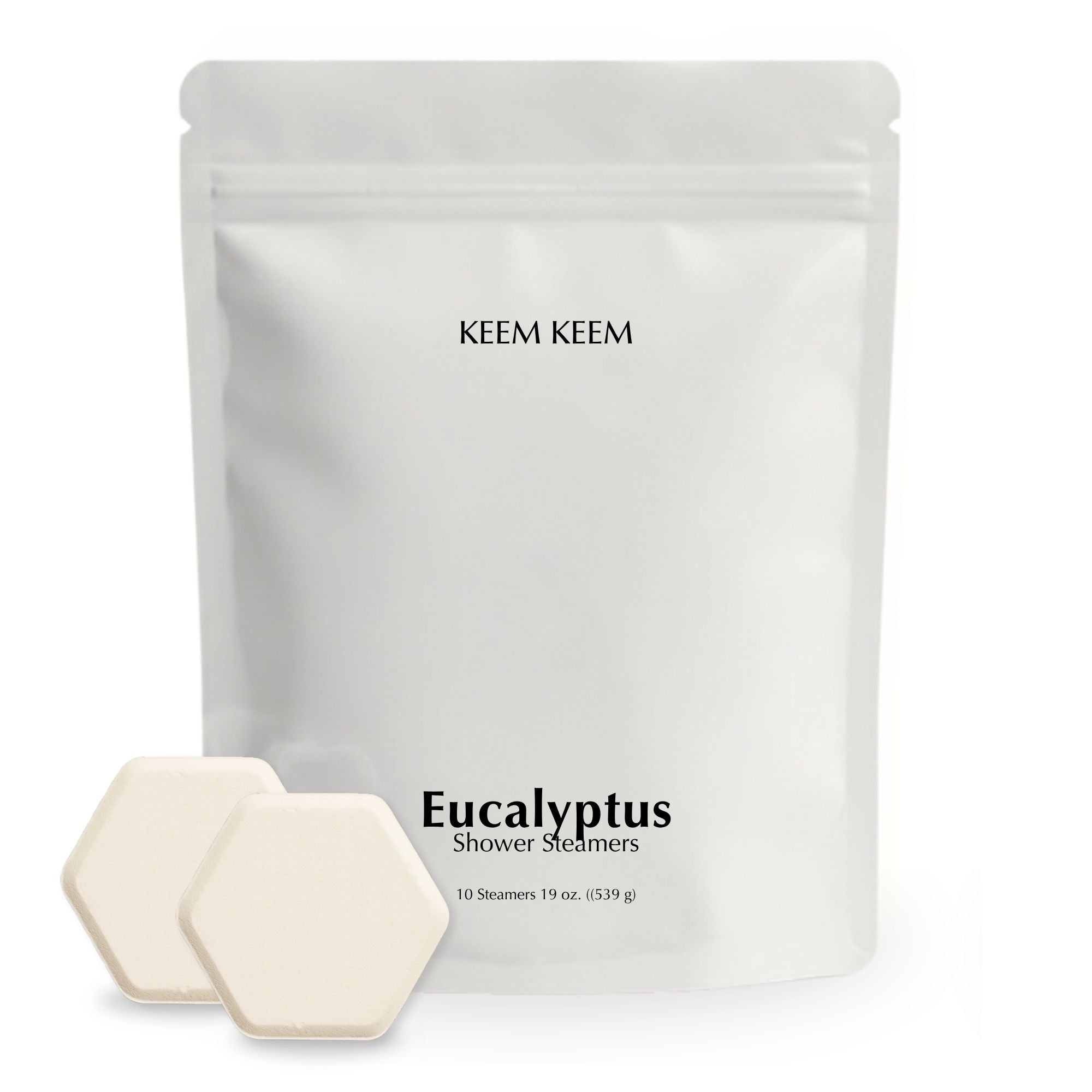 Minimalist stand-up pouch of Keem Keem Eucalyptus Shower Steamers with two hexagon tablets displayed in front, showcasing clean packaging and product size.