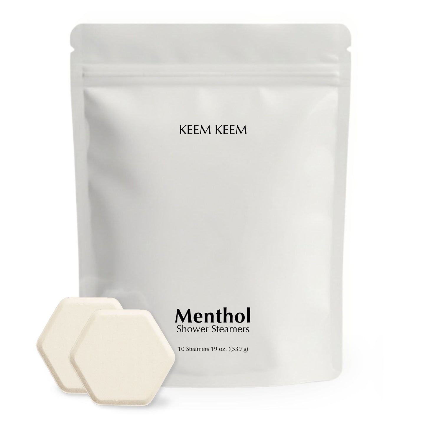 Minimalist stand-up pouch of Keem Keem Menthol Shower Steamers with two hexagon tablets displayed in front, showcasing clean packaging and product size.
